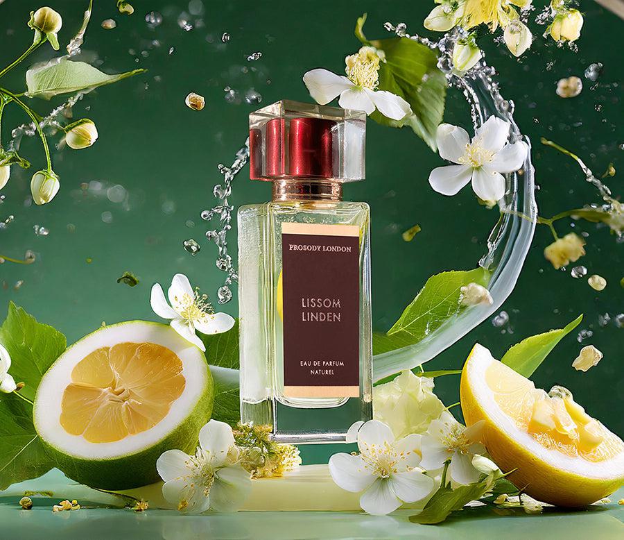 Perfume bottles with water splash and linden blossoms