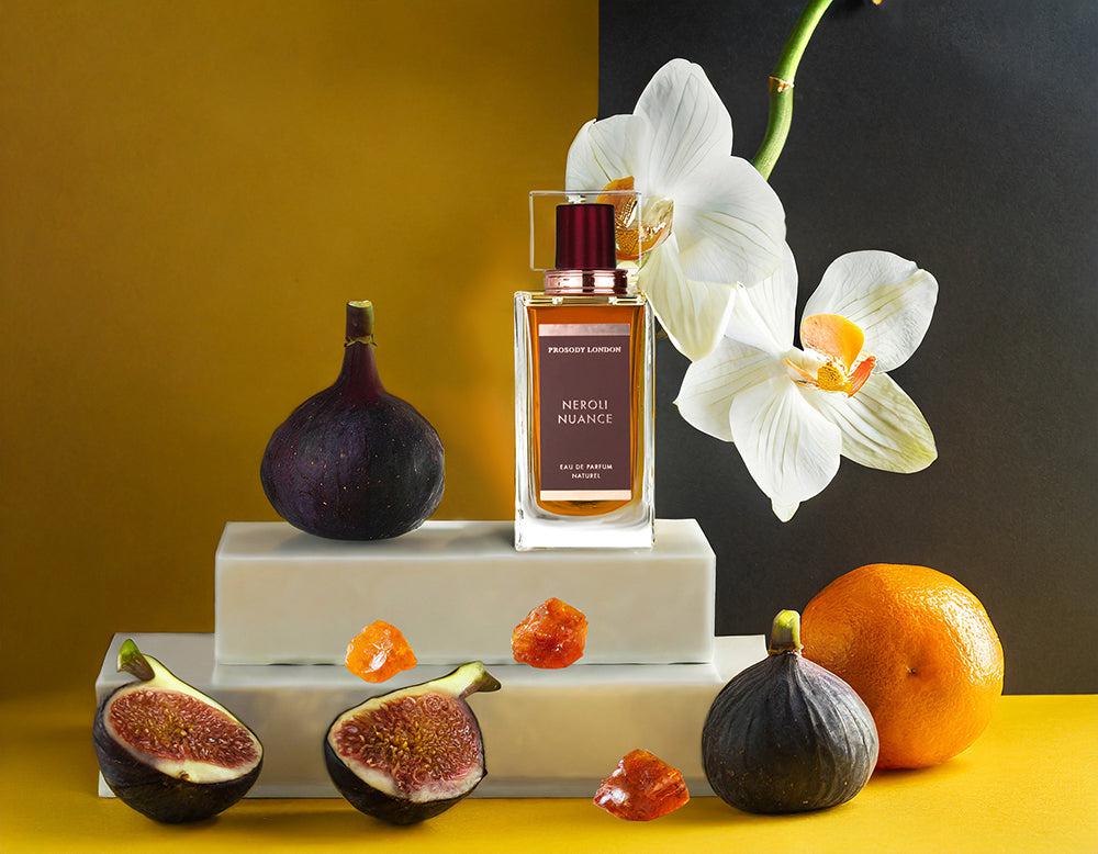 Neroli Nuance perfume bottle with white orchid and figs