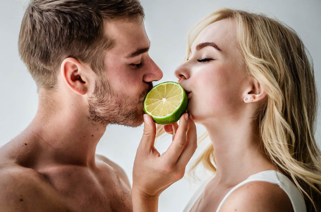 couple kissing a halved bergamot