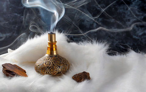 Oud incense on fur with marble background