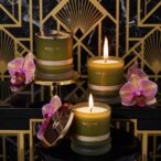 whisky wisteria natural candle with orchid and art deco wall
