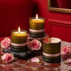 rhapsodic rose natural candle by prosody london with pink roses